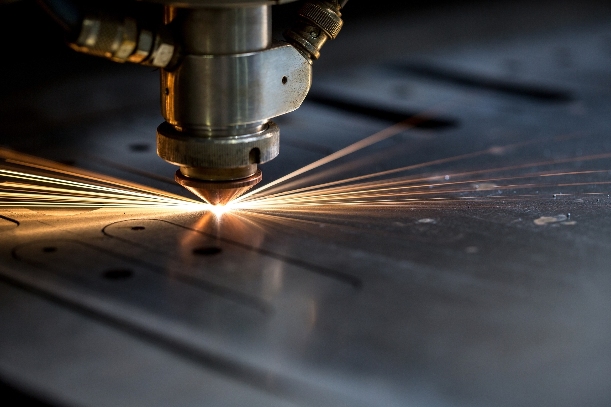 Cutting,Of,Metal.,Sparks,Fly,From,Laser