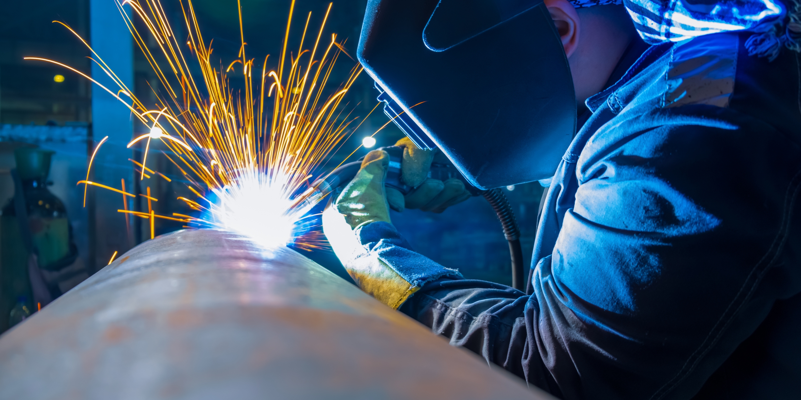Welder,Working,With,Electrode,At,Semi,Automatic,Arc,Welding,In